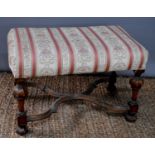 A walnut 19th century stool, with shaped and turned legs united by wavy X-form stretcher, 41cm