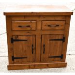 A modern pine cabinet with two drawers and two cupboard doors 88cm by 91cm by 46cmThe piece is solid