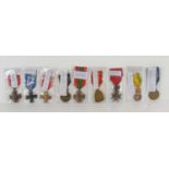 A group of medals to include a WWI Belgium Victory Medal, French Military Valour Cross, Croix De