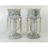 A pair of 19th century glass opaque lustres, painted with flowers and gilt highlights with cut glass