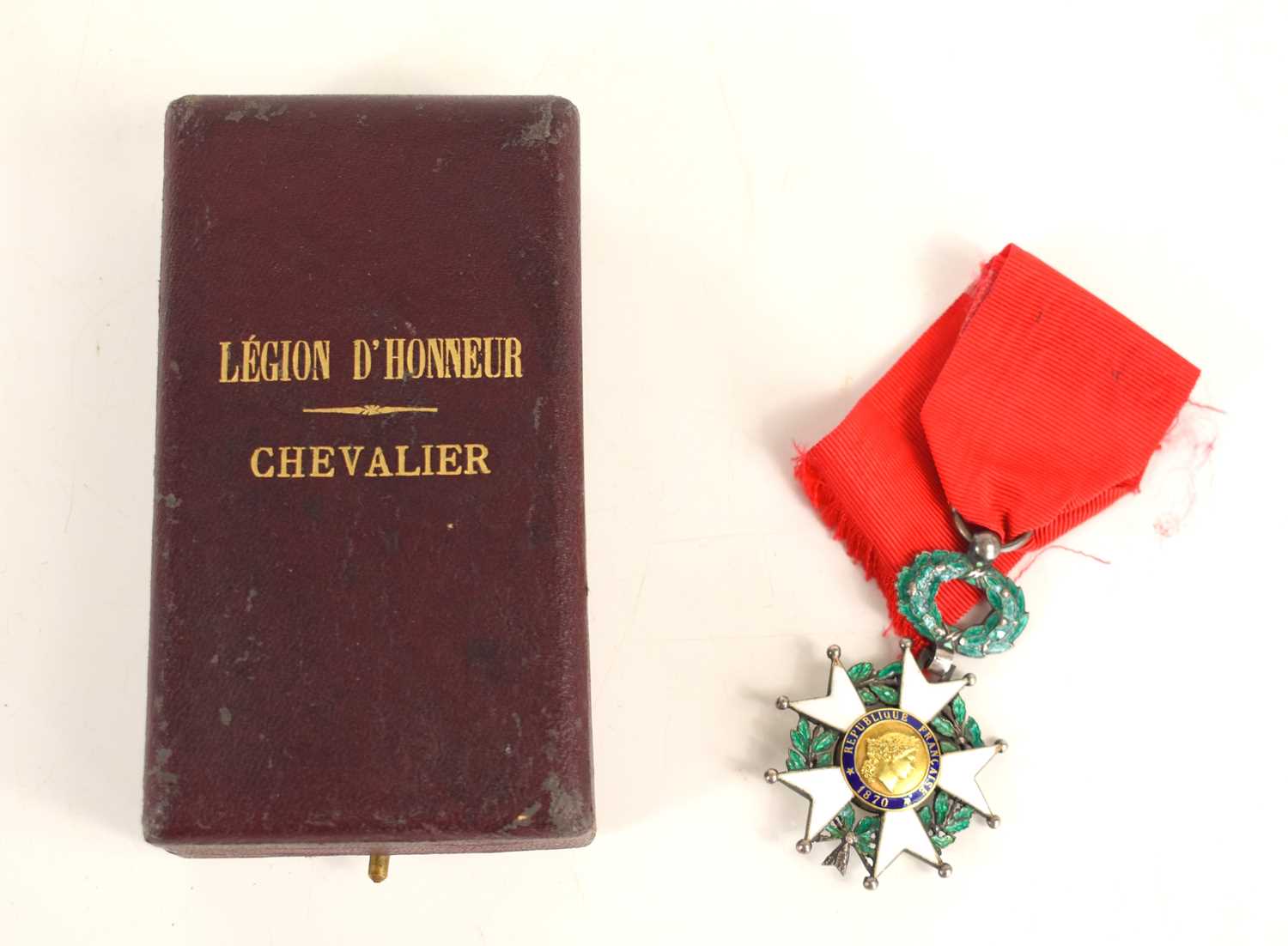 A French Legion of Honour medal with its wreath suspension, in its hardshelled case of issue, the