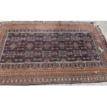 A Middle Eastern orange and blue ground rug.