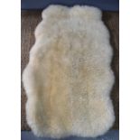 A sheepskin rug, oval shape, 160cm.