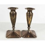 A pair of continental white metal candlesticks, of fluted form, 12toz.