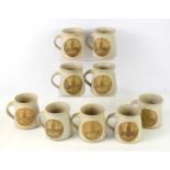 Local interest: A group of nine Stuart Marsden of Somersham Pottery stoneware mugs decorated with