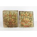 A pair of painted and carved wall bosses or plaques, likely 18th century or earlier, the carved