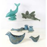 A quantity of studio art pottery to include two wall pockets in the form of a bird, a green glazed