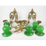 Three brass wall sconces, each with two branches and decorated with scroll work and phoenix birds,