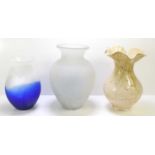 A group of three studio style glass vases, comprising a blue and white baluster vase, a frosted