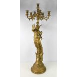 A large five branch candelabra supported by a winged female victory on a shaped platform base, 109cm