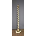 An antique style plaster standard lamp with a gold coloured cord design, 154cm high.