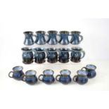 A collection of Elisabeth Bailey studio pottery mugs in a blue glaze together with six Iden
