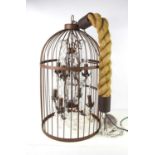 A large metal birdcage chandelier with faceted crystal glass, with rope and chain for hanging,