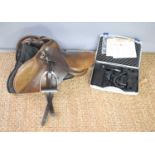 A Lovatt and Ricketts leather horse saddle together with a set of Avalon horse clippers.