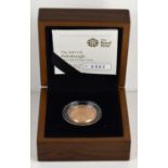 A Royal Mint 2011 Edinburgh £1 Gold Proof Coin, 22ct gold, 19.619g, with certificate and case.