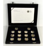 A Royal Mint 25th Anniversary One Pound Coin Silver Proof Collection of fourteen coins, in a