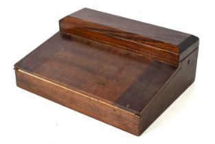 An antique mahogany writing box, the two lids opening to reveal two interior drawers and a