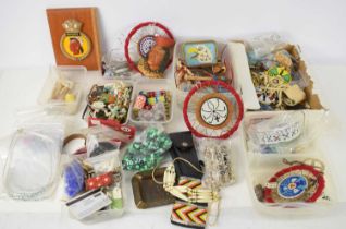 A collection of modern Native American collectables to include beaded decorated lighters, pierced