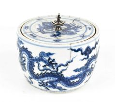 A Chinese blue and white bowl and cover, depicting a five claw dragon in underglaze blue, the
