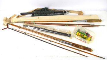 A group of vintage fishing rods and lures to include a Sakura bamboo rod, Rapala lure and other