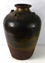 A large 19th century terracotta urn of elongated globular form with tapering neck, with four small