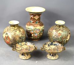 A group of 20th century Satsuma wares, comprising vase, 23cm high, a pair of spherical vases and a