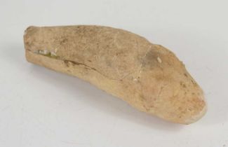 An excavated carved chalk stone phallus, possibly Roman, 15cm.