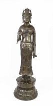 A bronze statue of standing Bodhisattva, raised on a lotus form base, signed verso, 69cm high.