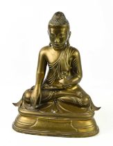 An early 20th century Burmese Buddha statue in cast bronzed metal, with inscription to the front,