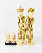 A pair of 20th century Chinese ivorine figures of a lady and gentleman in traditional dress, each