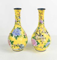 A pair of Chinese cloisonne vases, the yellow ground with birds amongst tree peonies, chrysanthemums