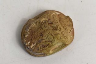 An antique Egyptian stone carved scarab beetle, the base carved with six lines of hieroglyphs, 4cm