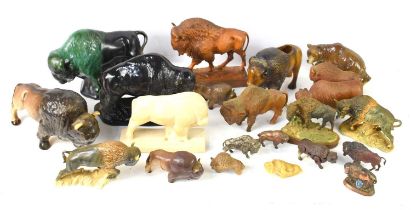 A collection of resin and ceramic buffalo ornaments to include an example by Goebel and Melba Ware