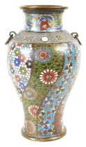 A Chinese bronze cloisonne vase with ring handles, decorated in polychrome lotus scrolls and