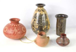 A group of pottery to include a terracotta pot, two Native American pots and a South American vase
