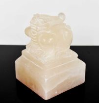 A Chinese soapstone seal, carved with a mythical creature sitting atop a stepped square form base, 6