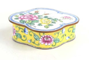 A Chinese enamel metalware box, deocrated with flowers, the sides with yellow ground, 11cm long.