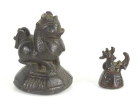 A Chinese bronze seal modelled as a cockerel and another larger, likely later.
