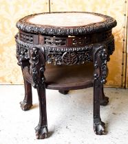 A Chinese hardwood carved jardiniere stand, inset with marble top, raised on five legs, carved and