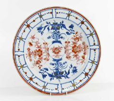 An 18th century Chinese porcelain charger, possibly Kangxi, in the Imari pallette, signed under,