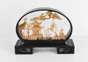 A 20th century Chinese cork display, in an ebonised and glazed case, 16cm high.