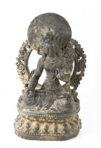 A stone carved Indonesian figure, seated Bodhisattva Avalokiteshvara, the bodhisattva of infinite