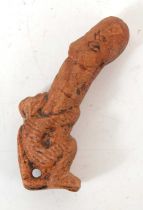 An antique Thai Paladkik pendant depicting a monkey and phallus, 6cm.