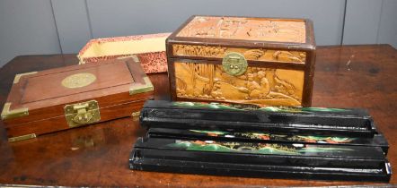 A set of four Chinese export lacquer Mahjong tile holders, each with decorated hinged lid over