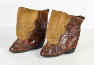 A pair of unusual leather lotus shoes or boots, having leather sole and heel, to a part leather