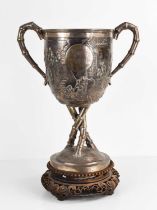 An early 20th century Chinese silver trophy by Luen Wo, Shanghai, with chased and repousse hunting