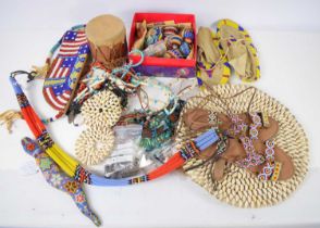 A collection of modern Native American and American collectables to include Huichol decorative eggs,