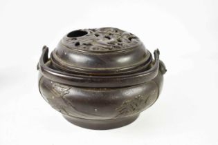A Qing Dynasty Chinese censor and cover, the body decorated with dogs of fo, the pierced lid cast in