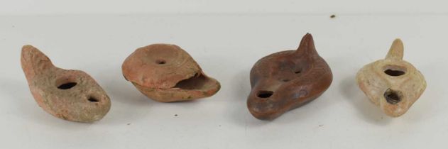 Three Romano-Egyptian oil lamps, circa 4th / 5th century, together with a modern example.