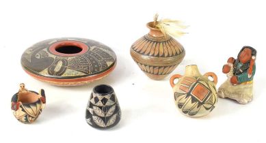A Native American Acoma pottery vessel together with a pottery figure of a mother and child signed